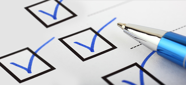 Check marks in boxes with blue pen