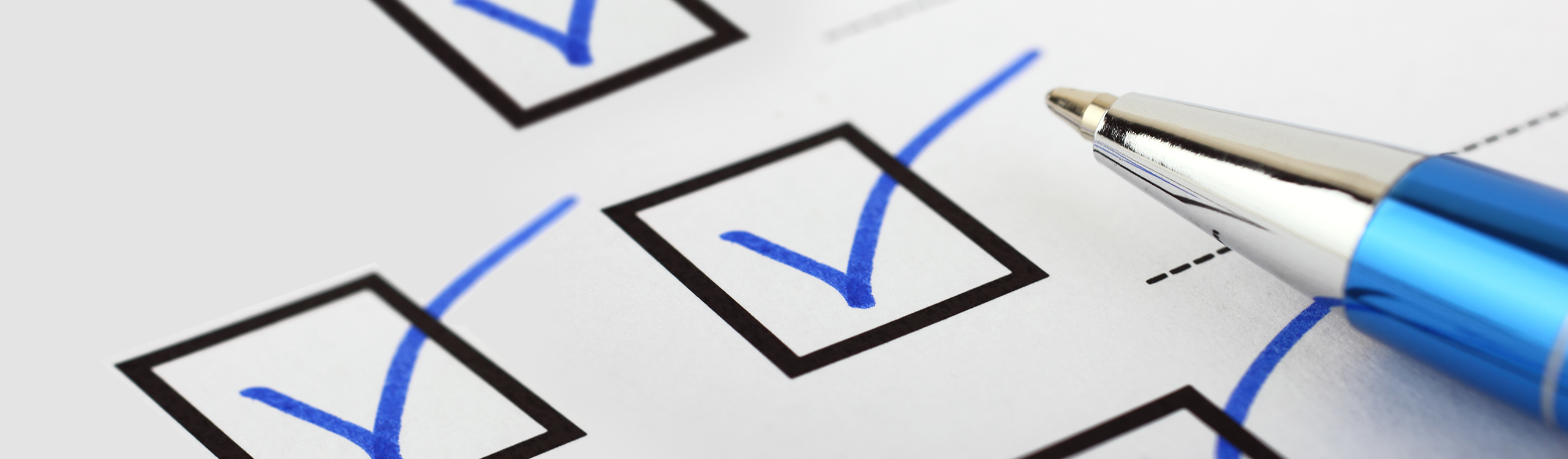 Check marks in boxes with blue pen